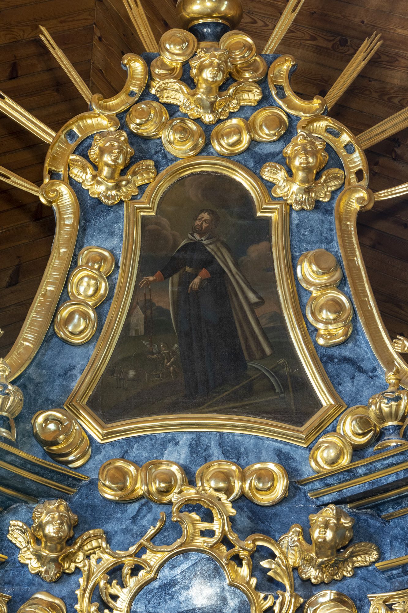 Obraz św. Izydora w ołtarzu bocznym prawym pw. Serca Pana Jezusa